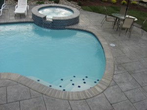 is stamped concrete slippery around a swimming pool